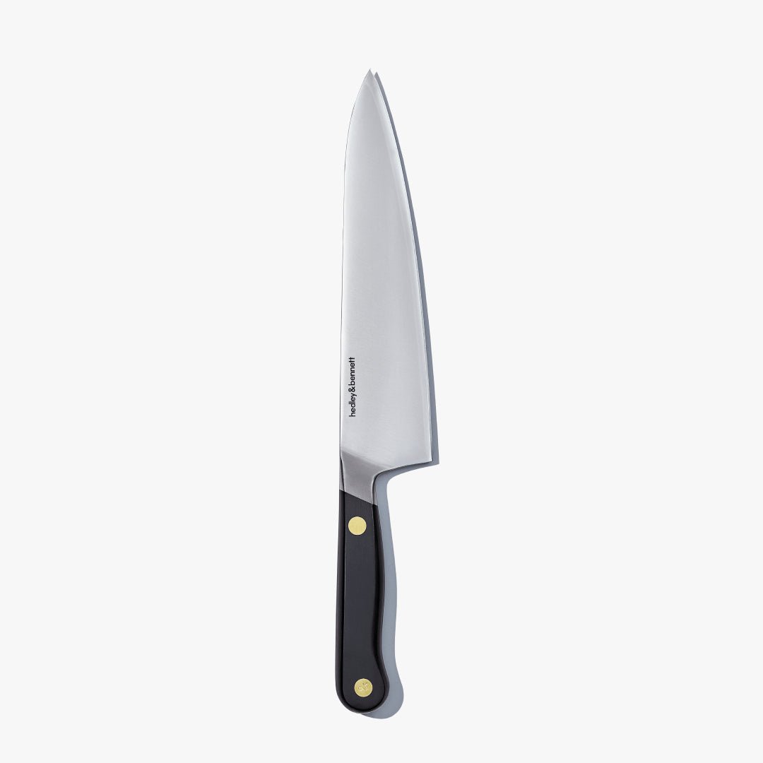 Chef's knife with a Caviar Black handle, standing upright