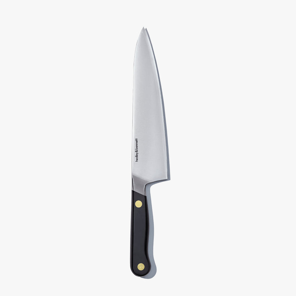 Chef's knife with a Caviar Black handle, standing upright