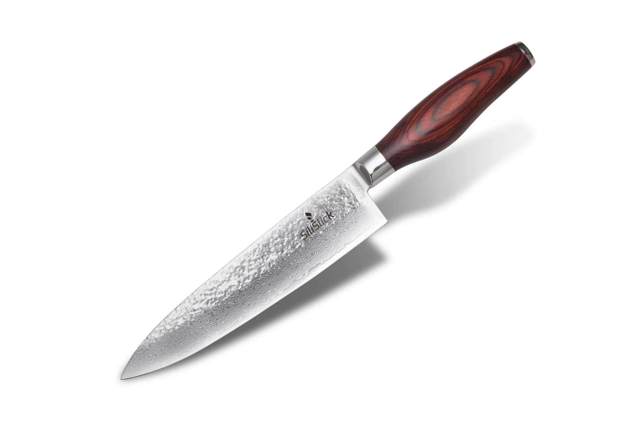 Damascus VG10 chef knife with hammered blade, angled with a soft shadow