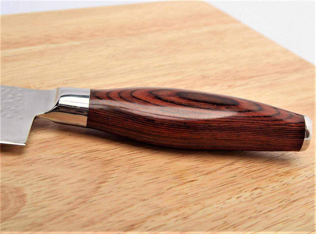 Close-up of the layered Pakkawood handle and steel bolster