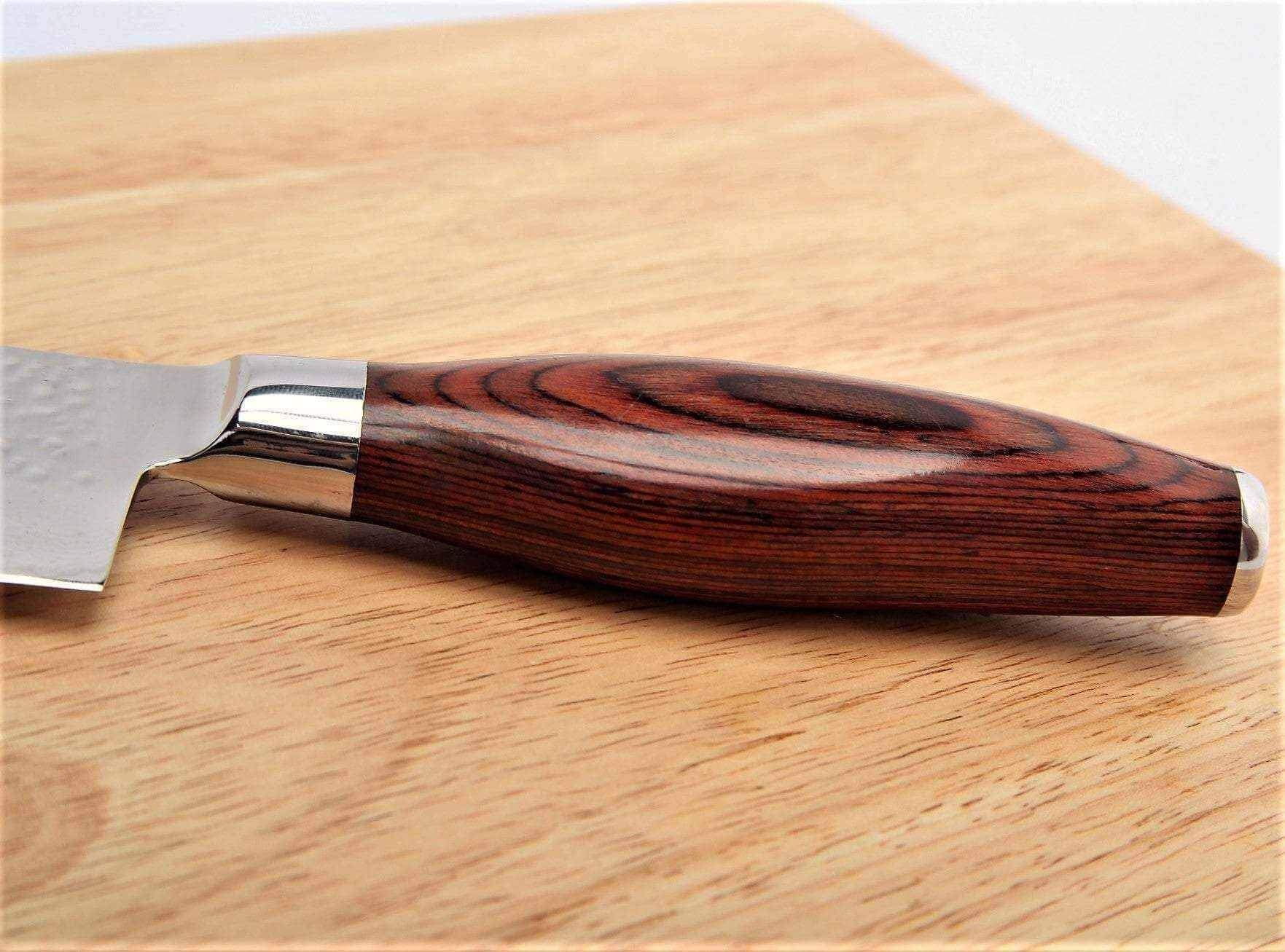 Close-up of the layered Pakkawood handle and steel bolster