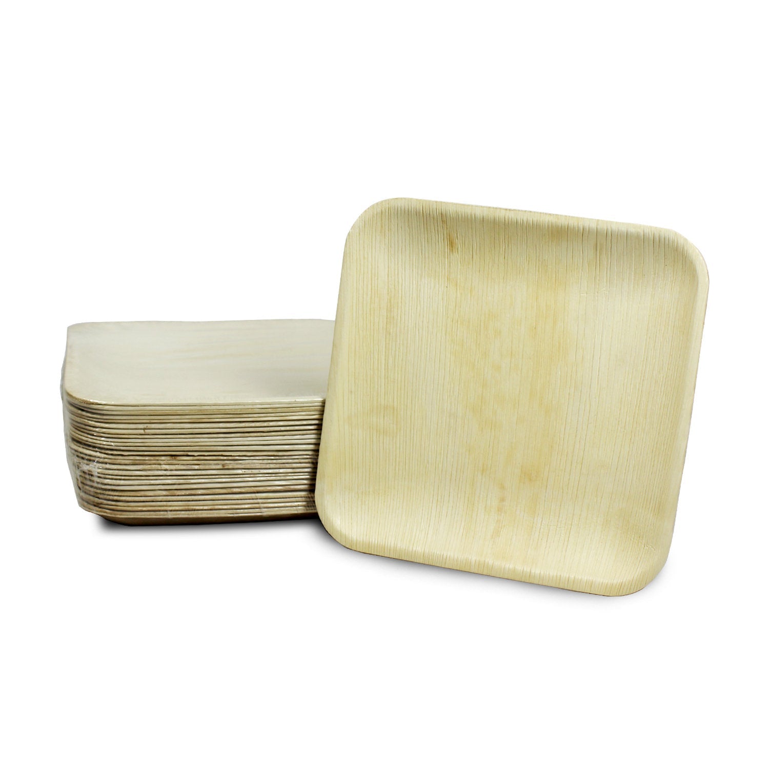 Square palm leaf plate propped against a nested stack of the same plates