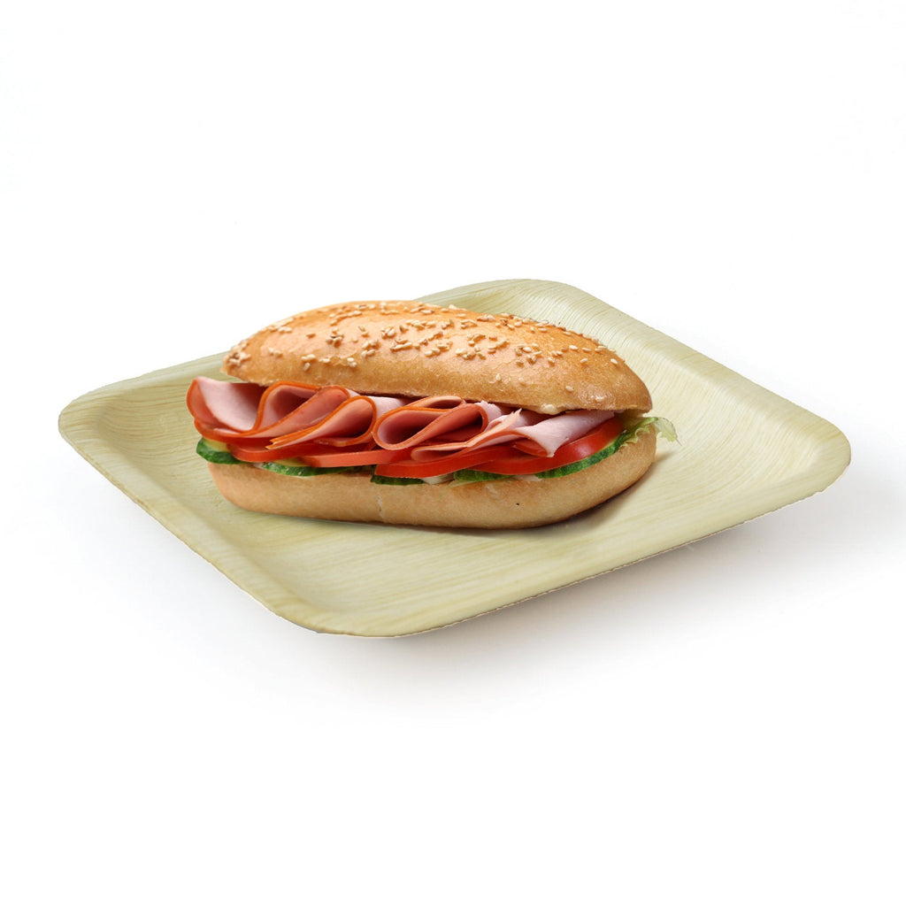 Deli sandwich on a square palm leaf plate