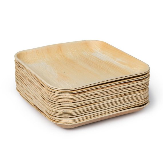 Tall stack of square palm leaf plates