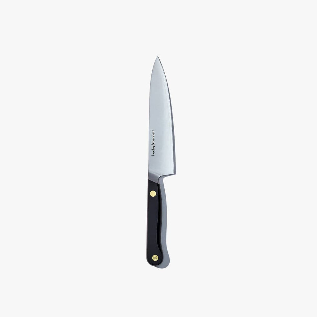 Utility knife with a Caviar Black handle, standing upright