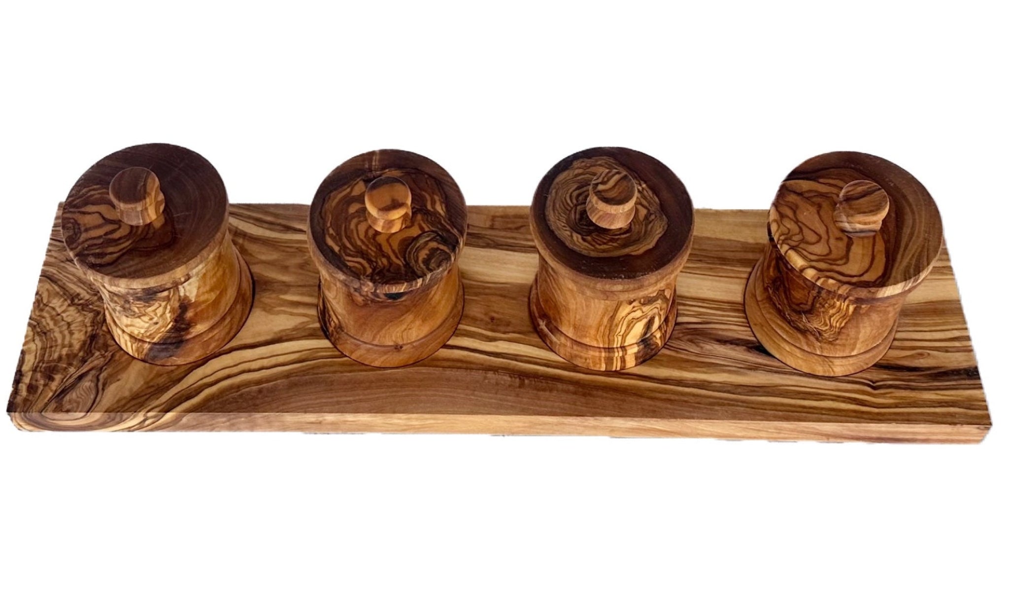 Four olive wood canisters with their lids resting ajar, seen from above on the base
