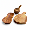 Three-piece olive wood set - mortar and pestle, bowl, and cutting board - on white