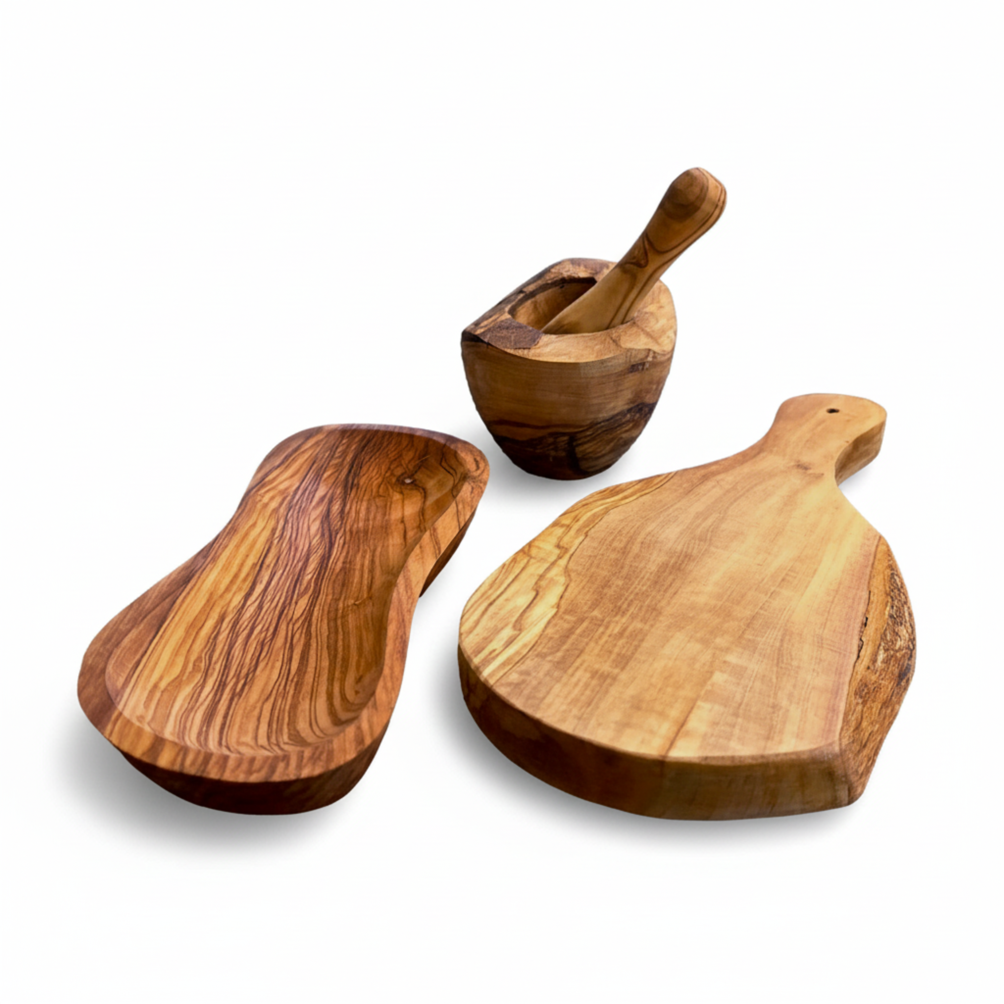 Three-piece olive wood set - mortar and pestle, bowl, and cutting board - on white