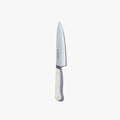 Utility knife with a white handle and brass pin, standing upright