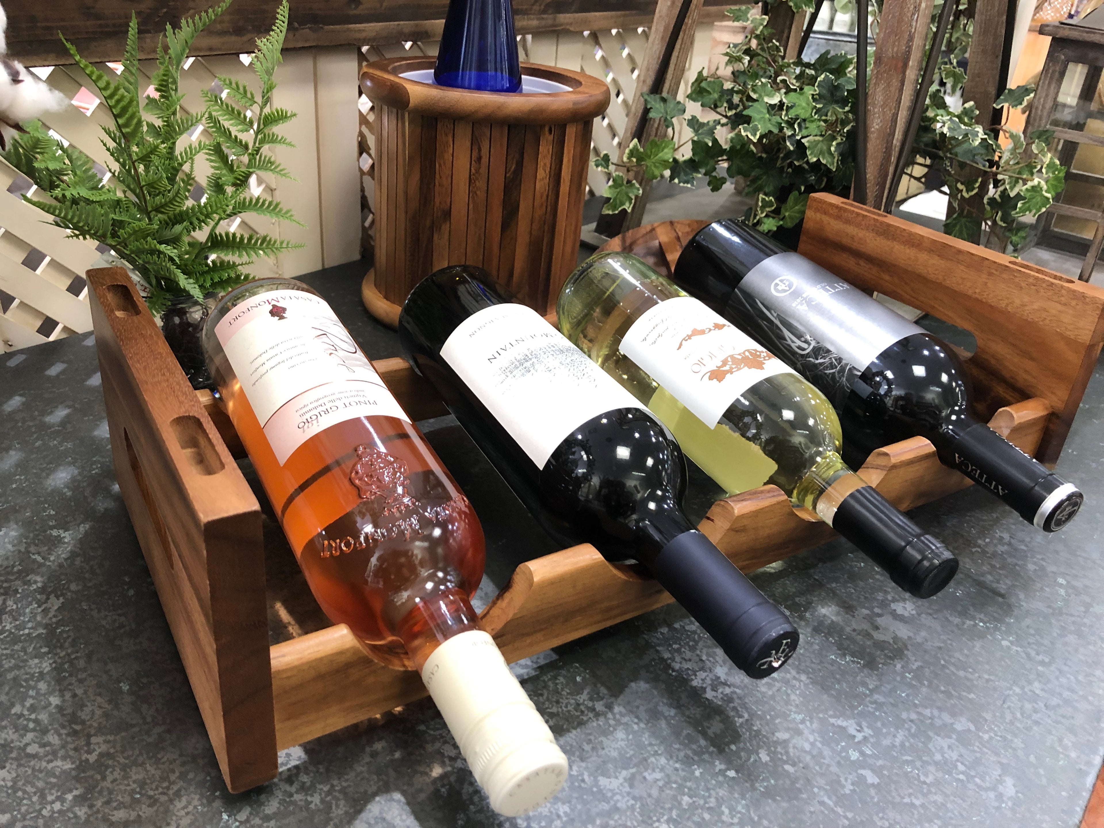 Wine rack in use, loaded with four bottles of wine