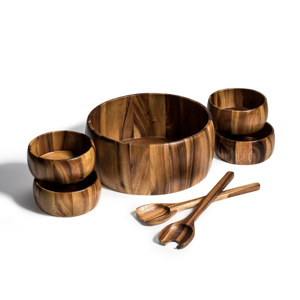 Seven-piece acacia salad set on white: large bowl, four individual bowls, and two servers