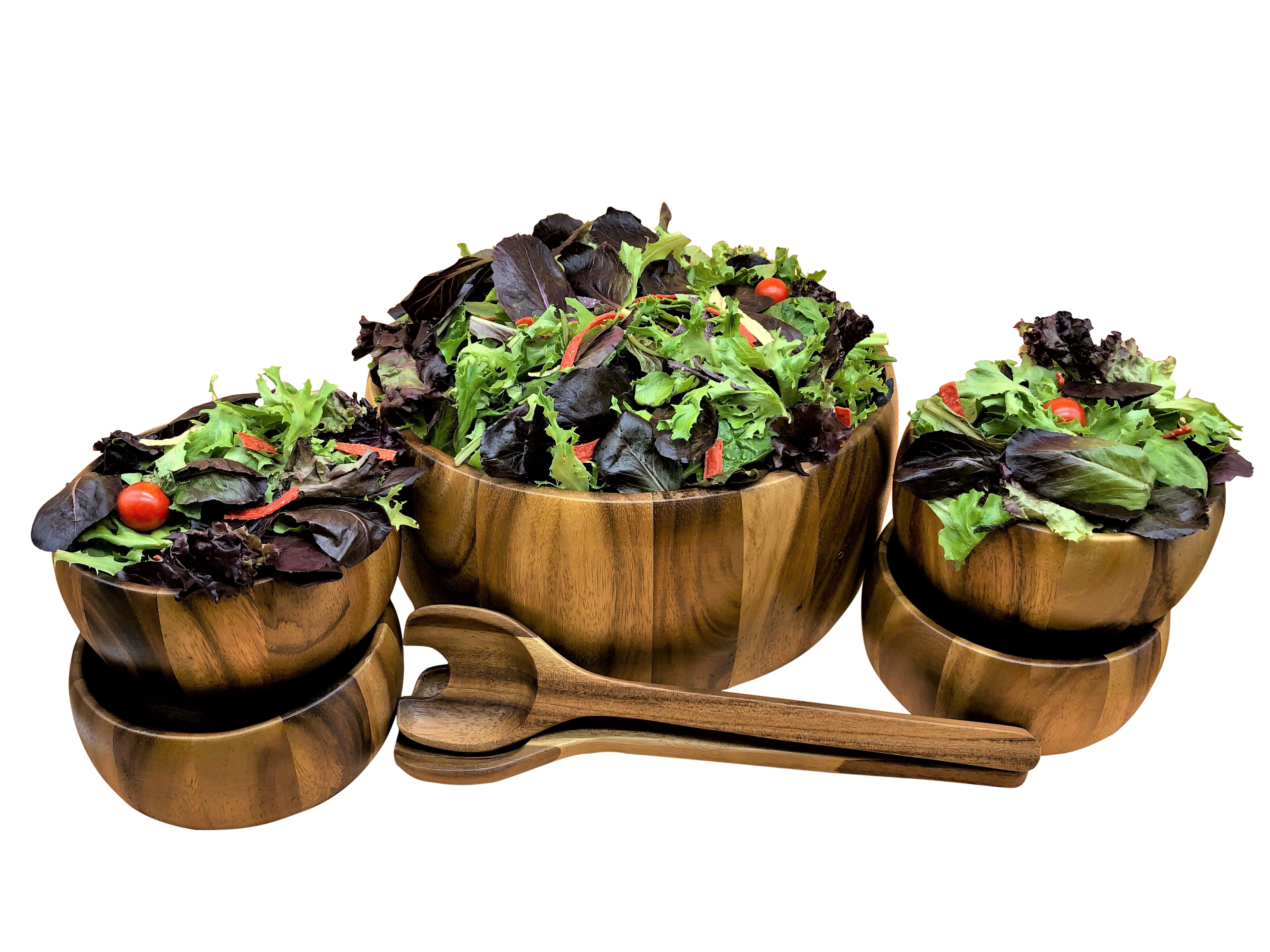 Large acacia bowl and four individual bowls filled with mixed greens, servers alongside